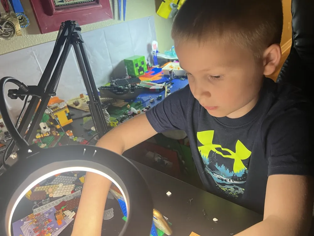 CJ working on a brick set under a ring light